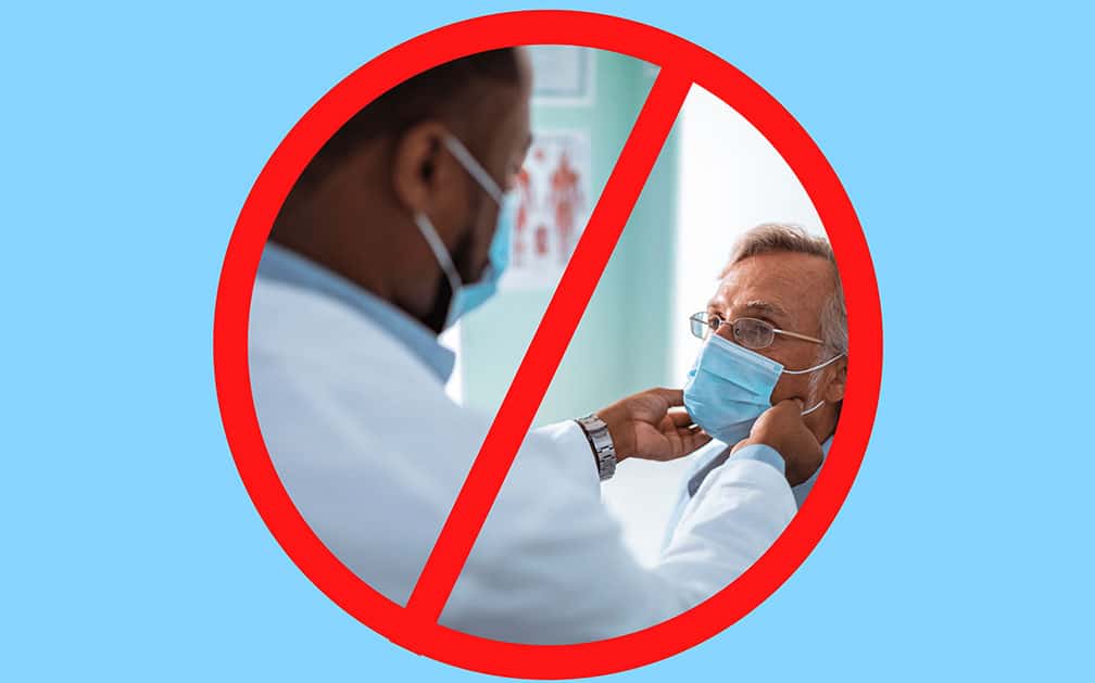 The image is of a male doctor examining an older man wearing glasses. The doctor’s hands just below his patient’s jawline. They both wear protective face masks per COVID restrictions. The image is in a red circle with a red line over it, signifying that life insurance can be obtained with no exam necessary.